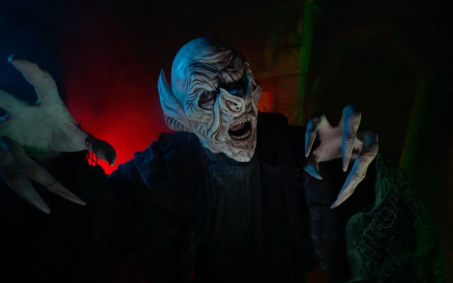 Vampire actor with his hands outstretched