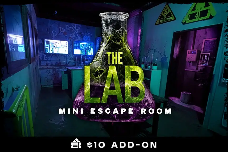 Neon‑lit beaker marked “The Lab” towers over a toxic research room escape game at Haunted Web Scream Park.