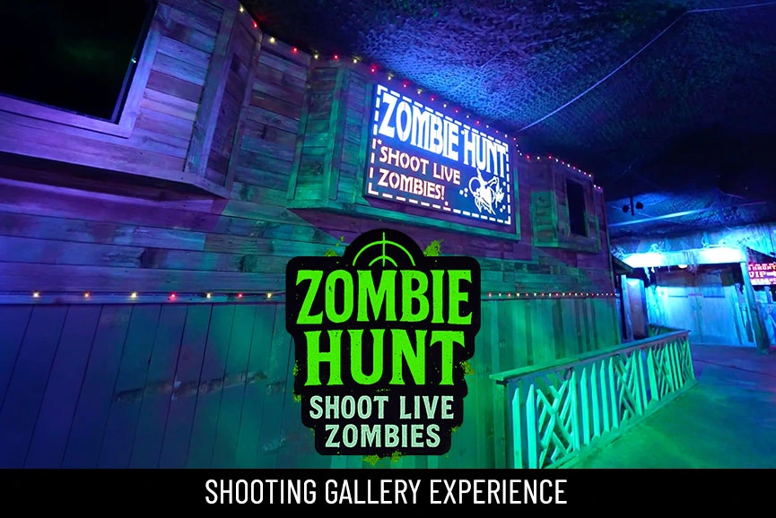 player aims GellyBall blaster at zombies in “Shoot to Survive” shooting gallery at Haunted Web Scream Park, Memphis TN